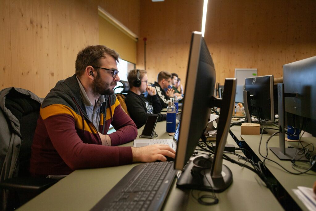 Team of IT professionals working on their computers