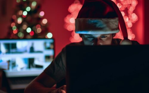 Person in Santa hat using laptop